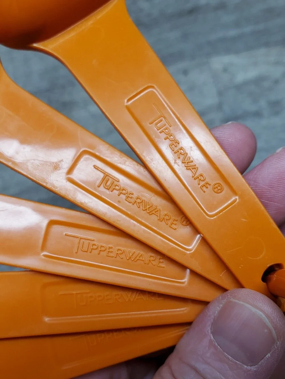 Vintage Tupperware orange measuring spoons